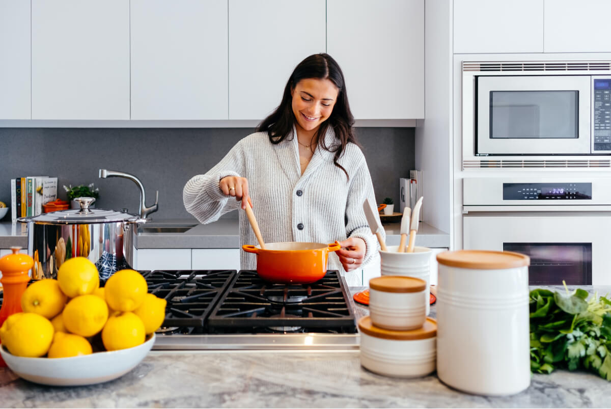 Lady cooking in kitchen