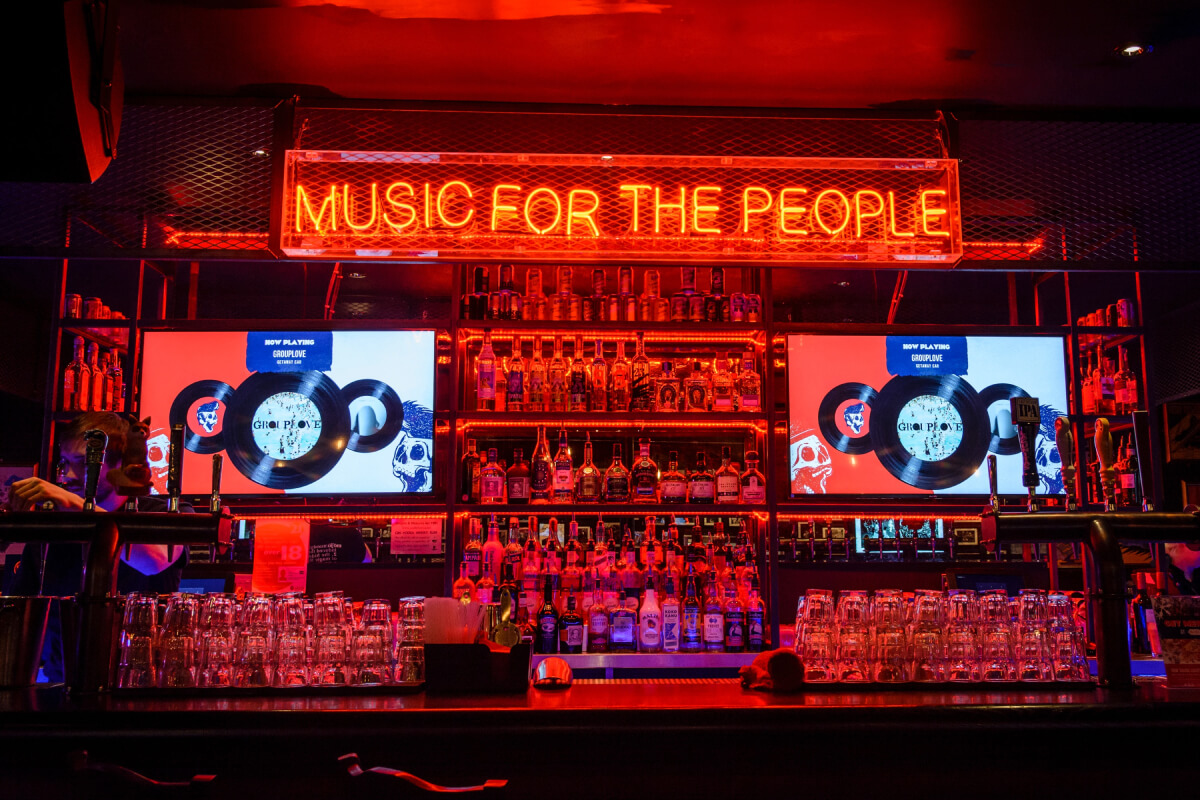 Bar with an illuminated music sign