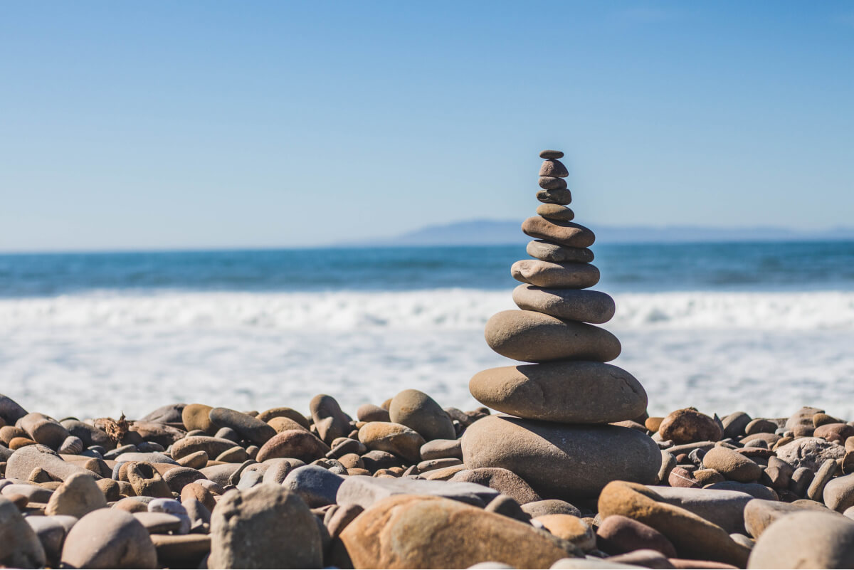 Pebbles stacked on the beach